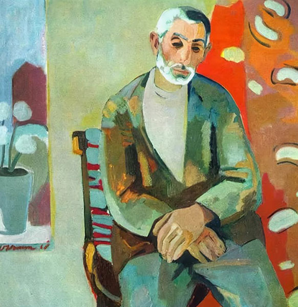 Vieil homme barbu assis sur une chaise tressée, veste verte, fond clair et tenture rouge — Minas Avetisyan